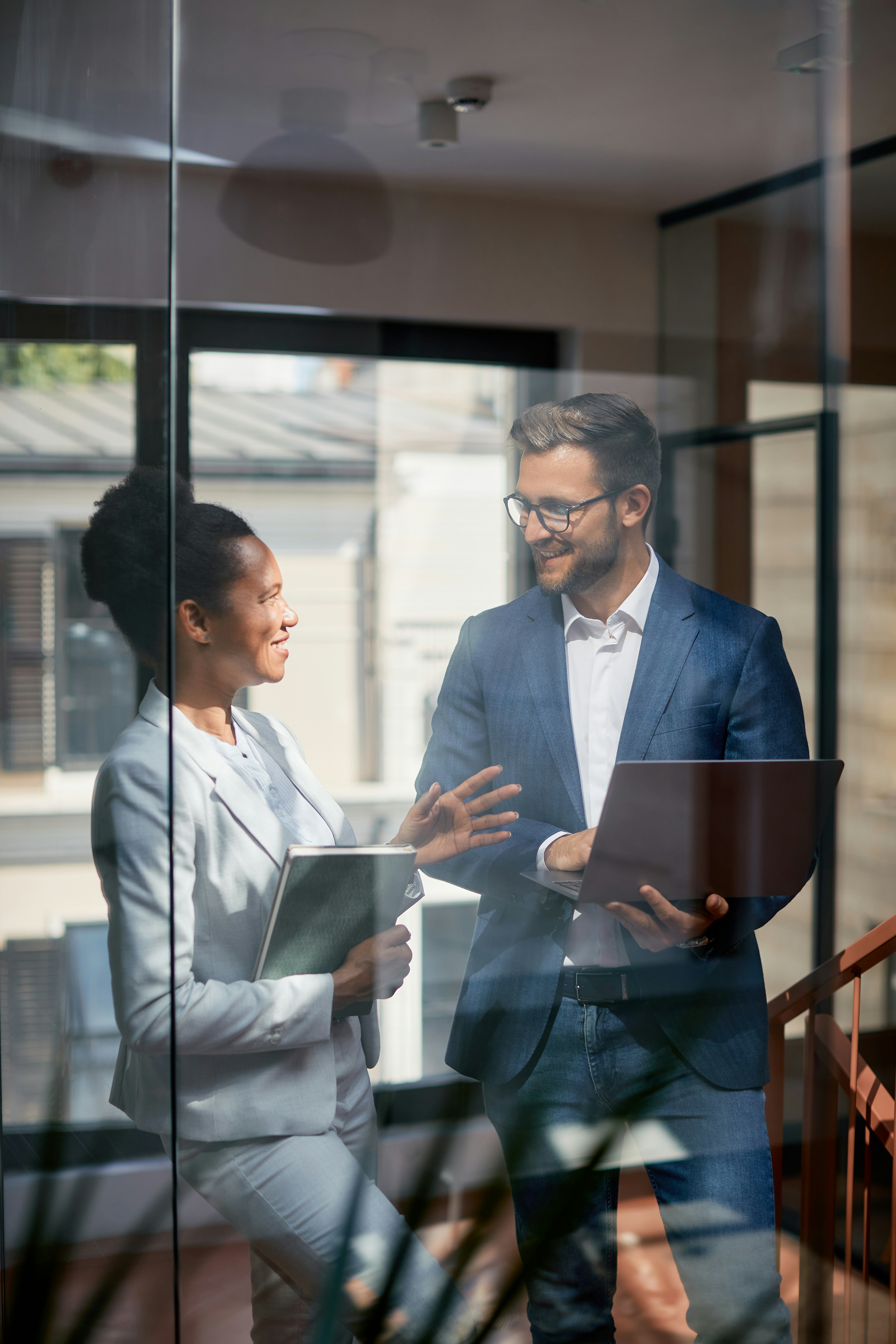 HR leaders collaborating with hiring managers in a modern office